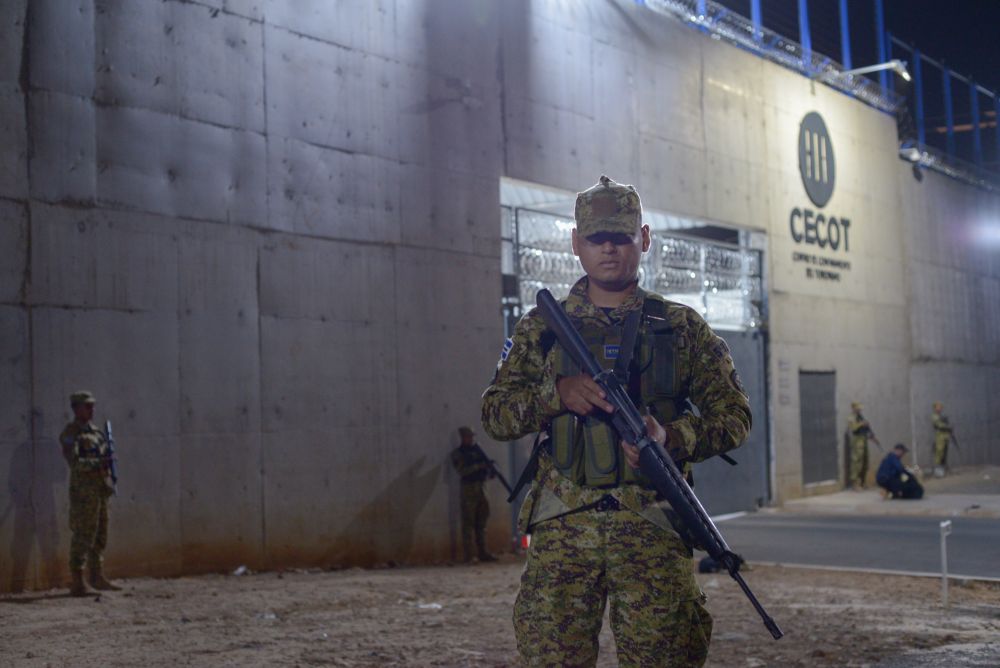 Members of the Armed Forces provide perimeter security outside the Terrorism Confinement Center (CECOT) in Tecoluca, El Salvador, which can hold up to 40,000 inmates. (Lissette Lemus)