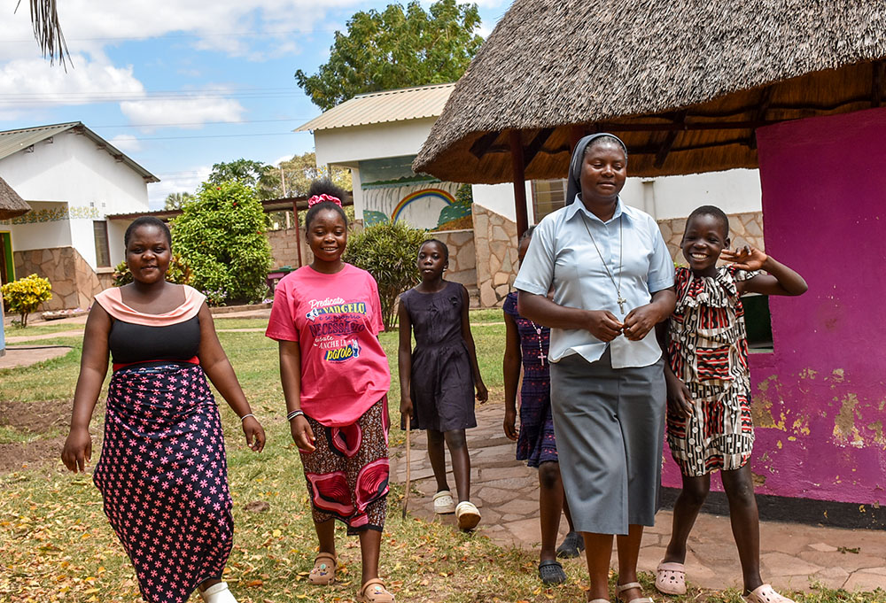 Sr. Sharon Shabolyo of the Sisters of Charity of Sts. Bartolomea Capitanio and Vincenza Gerosa with some of the girls she helps care for at the Mudzi-Wa-Moyo Orphanage in the Chirundu District of Zambia. (Derrick Silimina)