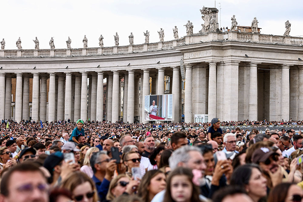 Faithful gather in St. Peter's Square as Pope Leo XIV leads the Angelus prayer from a window of the Apostolic Palace, following his discharge from hospital after surgery for lung cancer, at the Vatican, Oct. 18, 2026. (OSV News/Reuters/Matteo Minnella)