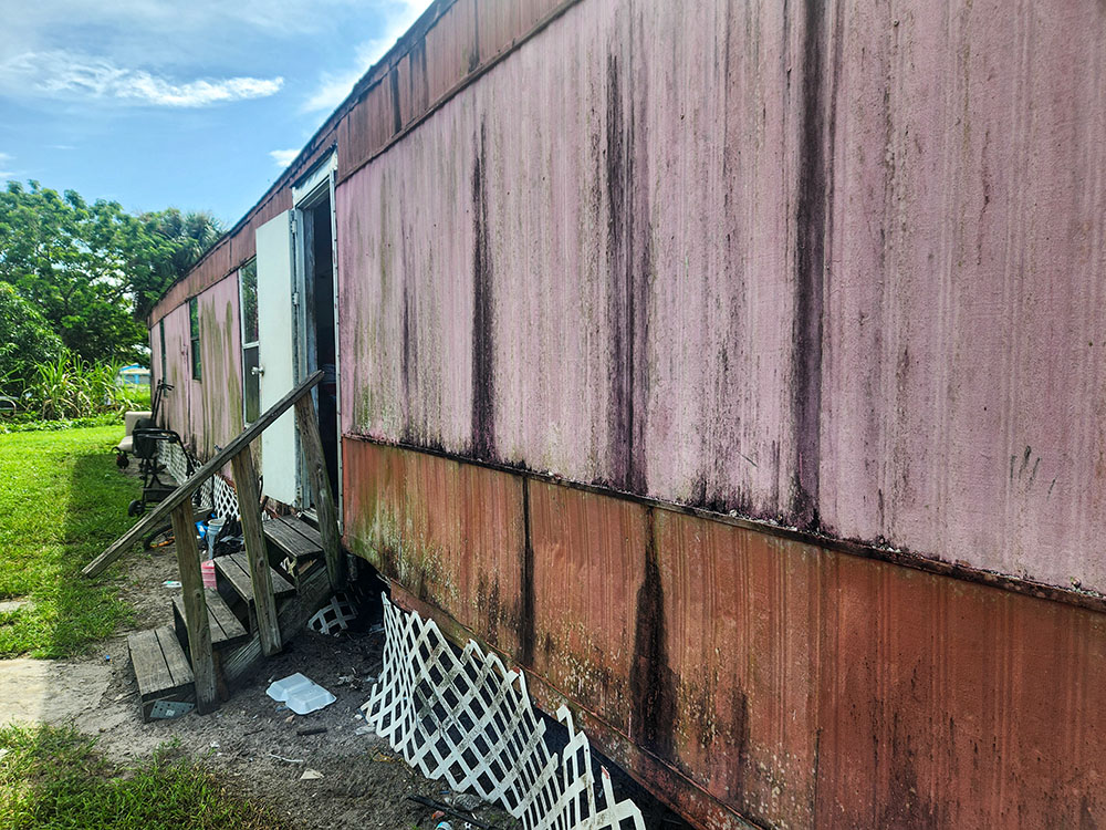 Trailer homes like this are typical residences for a Haitian family in Immokalee, Florida. (GSR photo/Chris Herlinger)