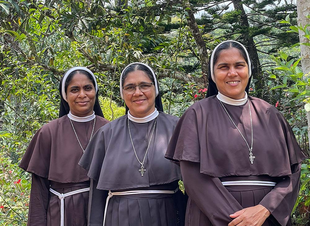 Srs. Ranit Pallassery, center, poses for a photo with her two supporters, Ancitta Urumbil, left, and Alphy Pallasseril, right. (Binu Alex)