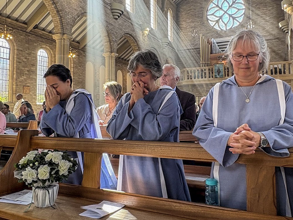 Sisters of the Community of Our Lady of Walsingham pray during the first vows of one of the sisters joining the community in Walsingham, England. (Courtesy of Community of Our Lady of Walsingham)