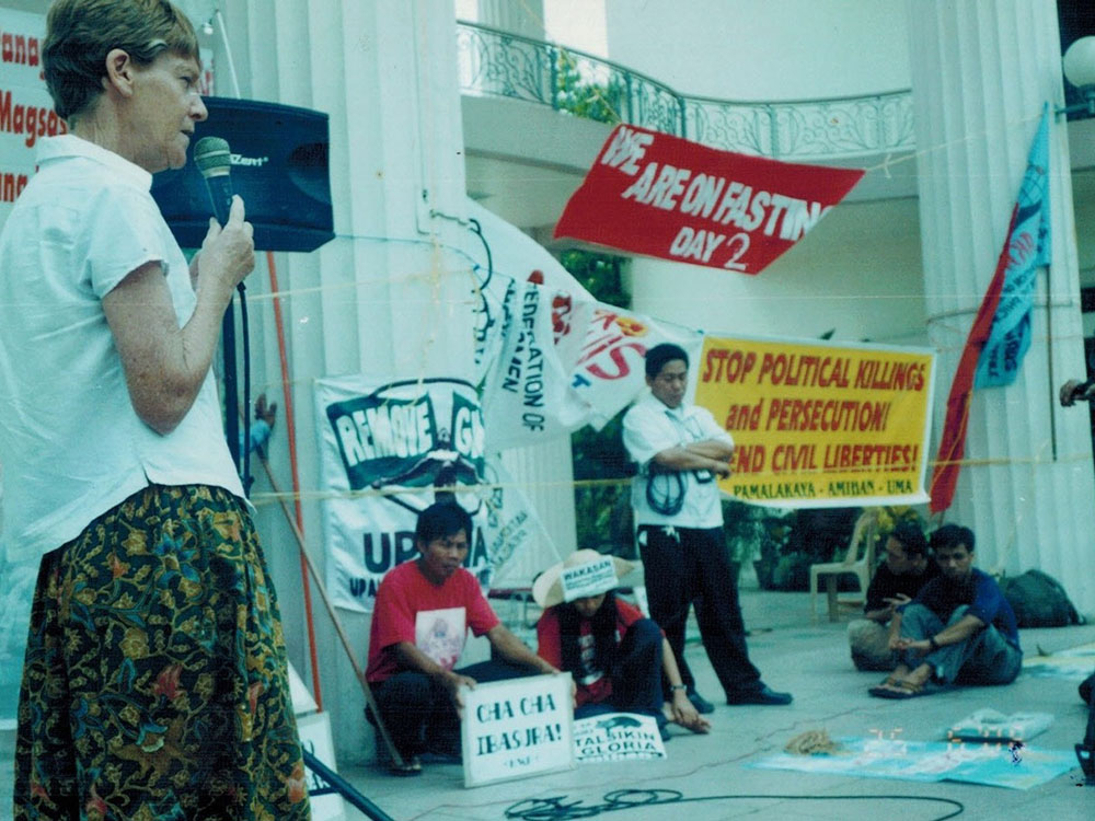 Sr. Patricia Fox joins farmers and agricultural workers in a rally on the steps of the University of the Philippines in Manila in 2013. (Courtesy of Patricia Fox)