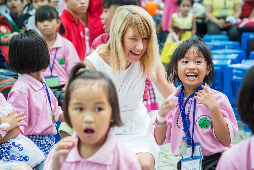 Frances MacLaurin playing with children in the Loveable Camp summer program for street children at Dam Sen Park (Provided photo)