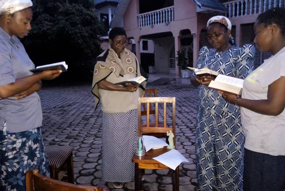 Ursuline Sisters pray outside of their house in the city of Goma, after a volcano eruption May 22 and subsequent earthquakes. The sisters pray outside to protect themselves against a possible collapse of their house. (Courtesy of Bernadette Mwavita/Ursuli Ursuline Sisters pray outside of their house in the city of Goma, after a volcano eruption May 22 and subsequent earthquakes. The sisters pray outside to protect themselves against a possible collapse of their house. (Courtesy of Bernadette Mwavita/Ursuli