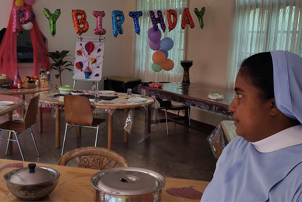 Salvatorian Sr. Ranjana Silvapulle, superior of the Child Development Centre at Ilupaikulam in Mannar, Sri Lanka, looks at the decorations done by orphans on her 40th birthday. (Thomas Scaria)