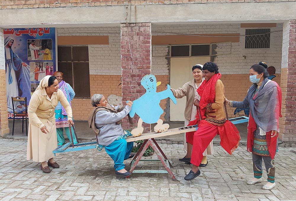 Sr. Mariam Gill (left) leads a sports session with female residents of Dar ul-Karishma (House of Wonders) in Youhanabad, a predominantly Christian district of Lahore, Pakistan. (Kamran Chaudhry) Sr. Mariam Gill (left) leads a sports session with female residents of Dar ul-Karishma (House of Wonders) in Youhanabad, a predominantly Christian district of Lahore, Pakistan. (Kamran Chaudhry)