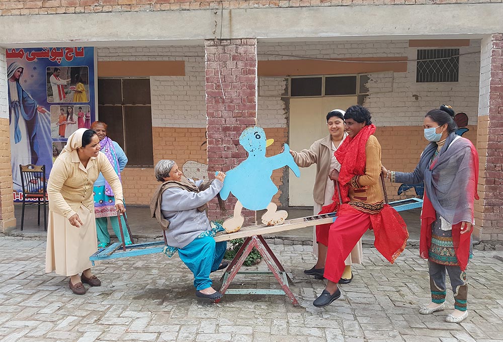 Sr. Mariam Gill (left) leads a sports session with female residents of Dar ul-Karishma (House of Wonders) in Youhanabad, a predominantly Christian district of Lahore, Pakistan. (Kamran Chaudhry)