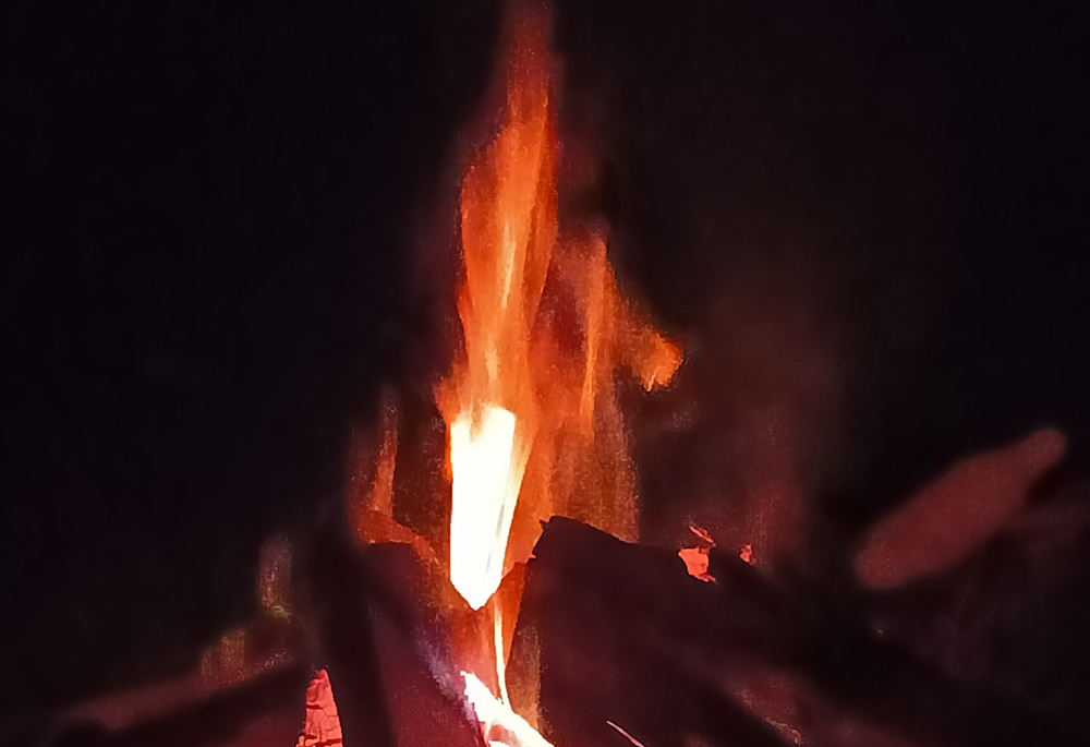 The campfire that burned during a retreat with young people from the village. (Marjorie Guingona)