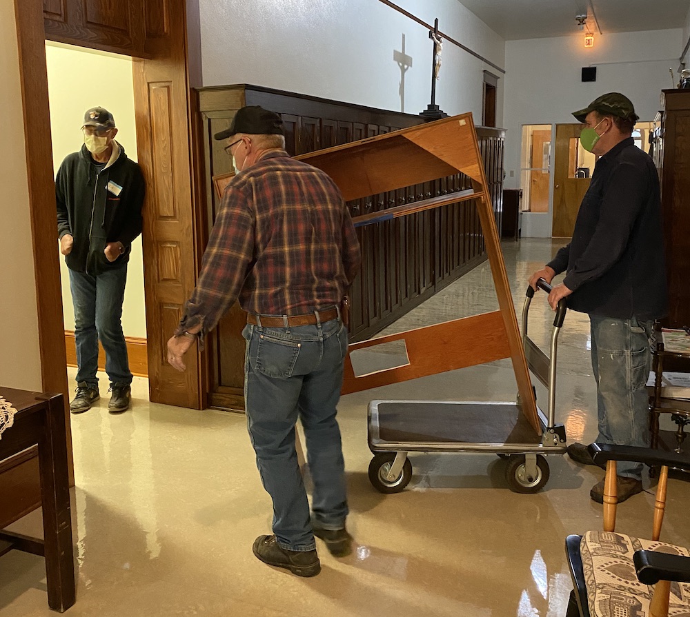 Workers from Arnzen Construction move furniture prior to starting a renovation of the residential Annex at the Monastery of St. Gertrude, Cottonwood, Idaho, in October 2020. (Provided photo)