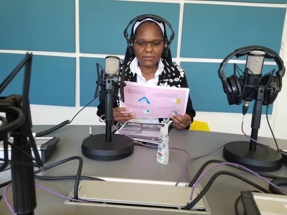 Sr. Astridah Banda, a Dominican Missionary Sister of the Sacred Heart of Jesus, prepares to deliver her COVID-19 radio program. (Courtesy of Astridah Banda) Sr. Astridah Banda, a Dominican Missionary Sister of the Sacred Heart of Jesus, prepares to deliver her COVID-19 radio program. (Courtesy of Astridah Banda)