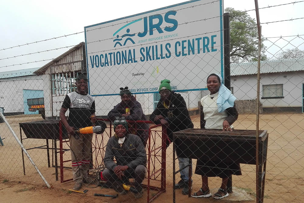 Sr. Mildness Chinake, right, visits welders. Vocational skills training is a key component of empowering refugees at the Tongogara Refugee Camp in Harare, Zimbabwe. (Courtesy of Mildness Chinake)