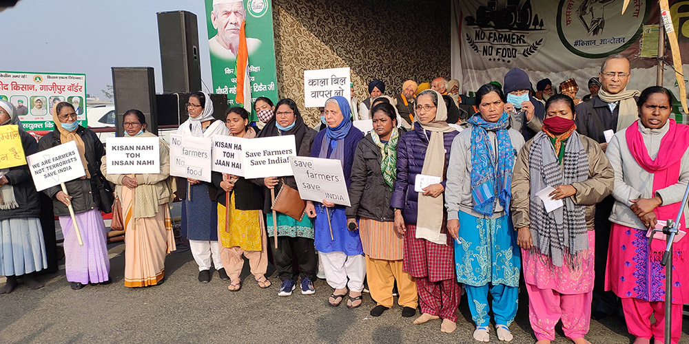 Catholic nuns and a priest with Forum for Justice and Peace and some members of the Delhi unit of the Conference of Religious India join the farmers protesting outside Delhi. (Courtesy of Dorothy Fernandes)