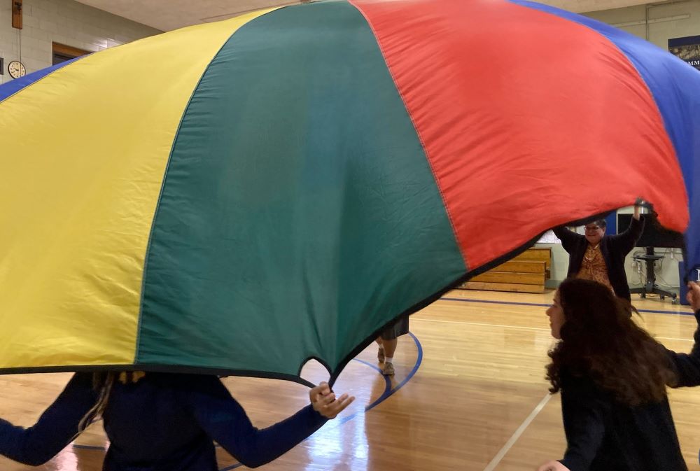 Students at Mount Mercy Academy in Buffalo, New York, play with a parachute. (Courtesy of Mike Hardy)