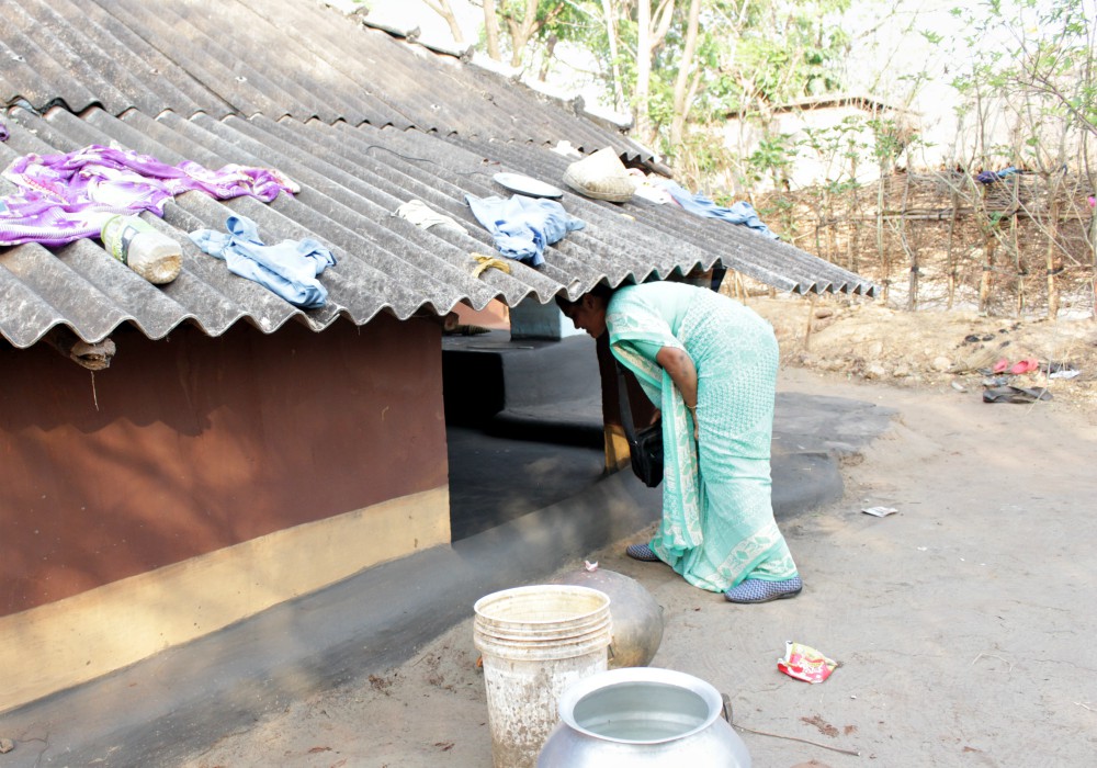 Sister Anita visits a Ho tribal house in her social service work. (Tessy Jacob)