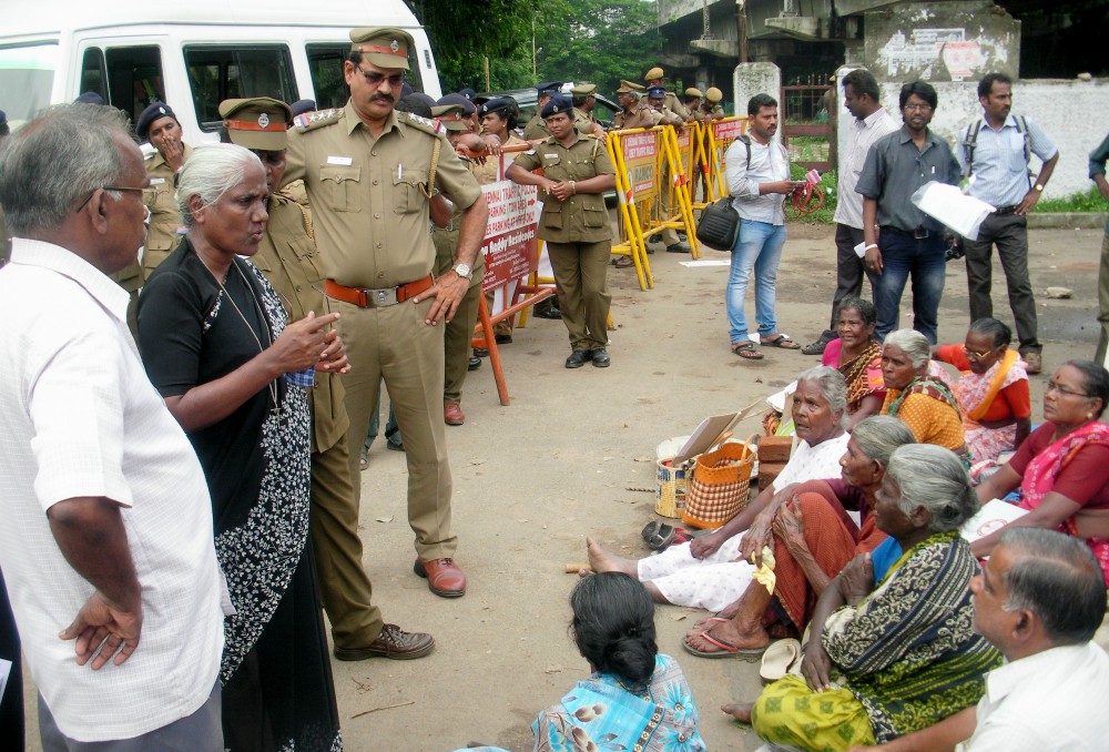 Gonzaga Sr. Anthonysami Alphonsa, standing between officers at left, addresses a meeting of Dalits in a village in the southern state of Tamil Nadu, India. (Provided photo)