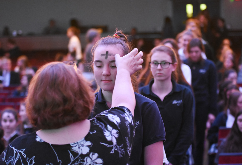 Students receive ashes at Our Lady of Mercy School for Young Women, Rochester, New York. Mercy Sr. Patricia Beairsto works with these students as a teacher. (Courtesy of Our Lady of Mercy School for Young Women)