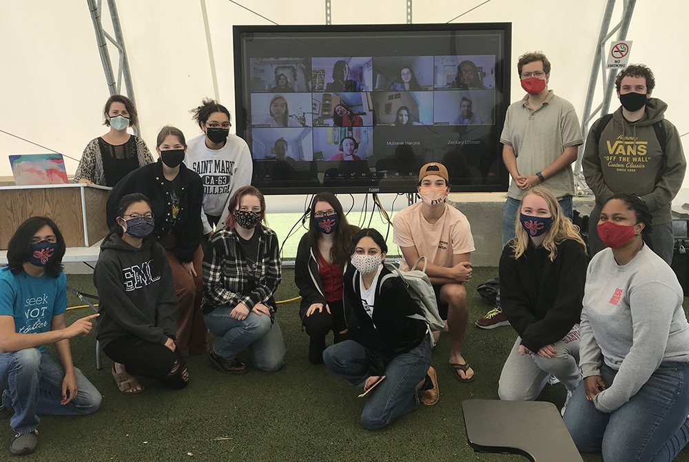 Anthropologist Anna Corwin, left rear by laptop, who has an upcoming book about Catholic sisters and aging, poses with her students at St. Mary’s College of California on the last day of their class (including online students shown on the screen). (Courte