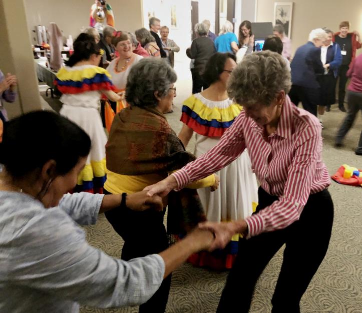 Attendees dance together as the international coordinator of Talitha Kum, Comboni Missionary Sr. Gabriella Bottani, gives instructions.