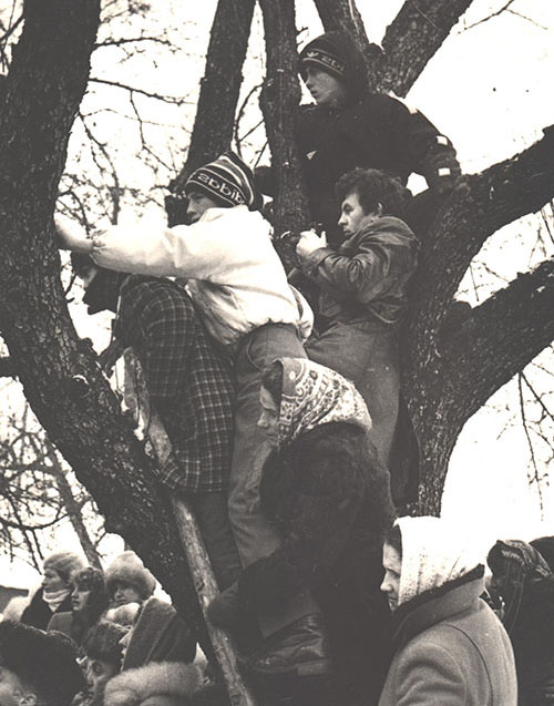 As in the Gospel account of Zacchaeus, people climb trees to see during a Ukrainian Catholic liturgy in the village Tserkivna, Ivano-Frankivsk region, Ukraine, 1989. (Courtesy of Basilian Sisters' museum, Osijek, Croatia)