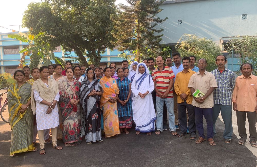 Sister Mary Joseph, new superior general of the Missionaries of Charity, stands with the workers and residents of Green Park Convent in Kolkata, India, where the congregation's general chapter was held in March. (Francis Sunil Rosario)