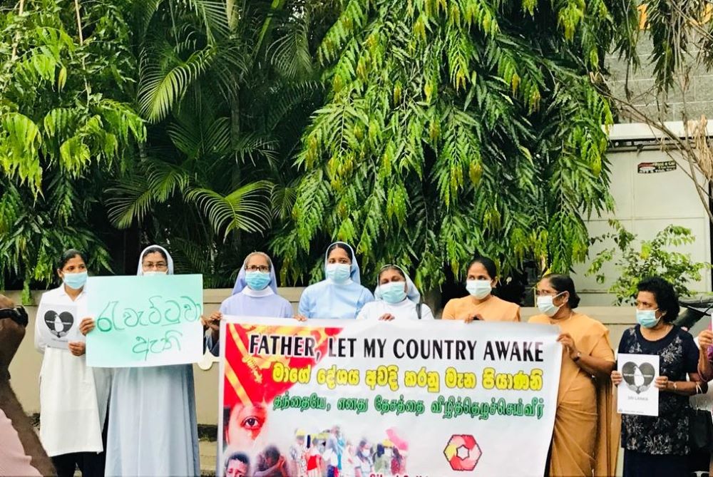 Sr. Shiroma Kurumbalapitiya, provincial of the Salvatorian sisters in Sri Lanka (center), leads a protest rally in Badulla. (Courtesy of Shiroma Kurumbalapitiya)