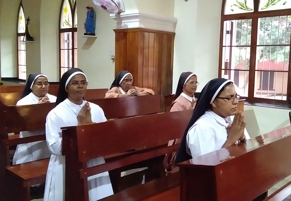 Sr. Sunitha Ruby (front row) prays in the Congregation of Carmelite Religious convent chapel in Thiruvananthapuram, Kerala, India. (Lissy Maruthanakuzhy)