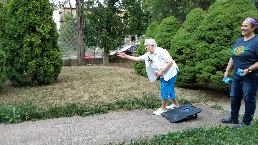 Dominicans of Peace Srs. Julia Grey, left, and Ana Gonzalez play cornhole outside their convent after Grey's 60th anniversary party Aug. 15. (Provided photo)