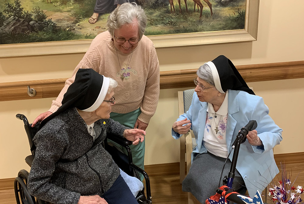 Sr. Benilda Nadolski, 99, left, the eldest of the Franciscan Sisters of St. Joseph and in the 79th year of her religious profession, converses with Sr. Marcia Ann Fiutko, center, and Sr. Alexine Machowicz, 89, at St. Francis Park this past spring. (Courte Sr. Benilda Nadolski, 99, left, the eldest of the Franciscan Sisters of St. Joseph and in the 79th year of her religious profession, converses with Sr. Marcia Ann Fiutko, center, and Sr. Alexine Machowicz, 89, at St. Francis Park this past spring. (Courte
