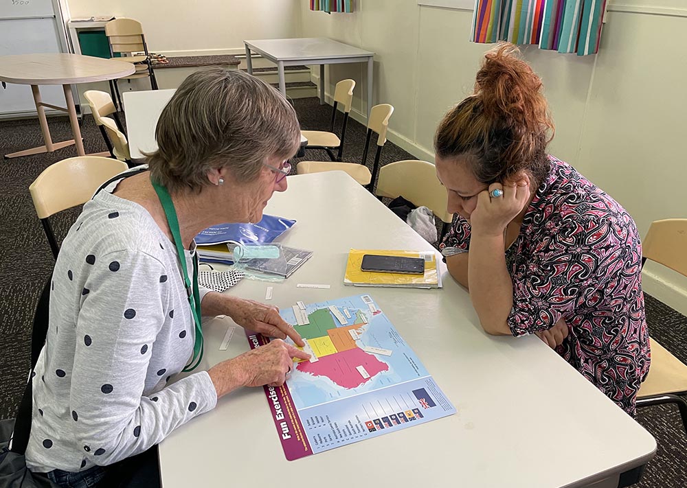 Zara's House volunteer Fiona Firth (left) assists Zuhal, an Afghan refugee. (Tracey Edstein)