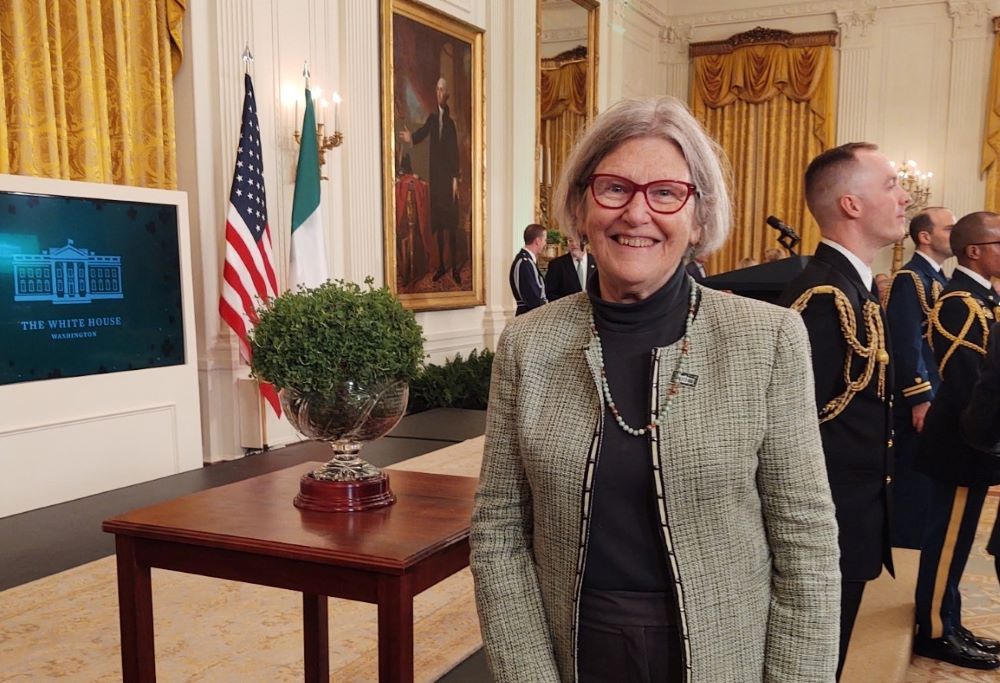 Social Service Sr. Simone Campbell poses with a bowl of shamrocks, a gift from the nation of Ireland to the United States, on March 17 [2022] at a St. Patrick's Day celebration at the White House in Washington, D.C. (Courtesy of Sr. Simone Campbell)