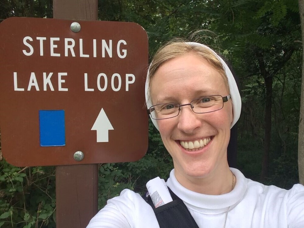 Sr. Kathryn Press stands at a trailhead in New York's Sterling Forest State Park in the Ramapo Mountains (Courtesy of Kathryn Press)