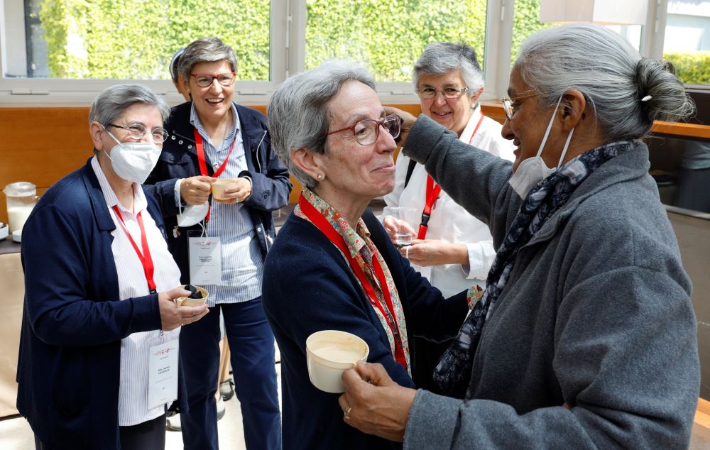 Sr. María Rita Calvo Sanz of the Sisters of the Company of Mary, Our Lady, greets Sr. Monica Joseph of the Congregation of the Religious of Jesus-Mary the plenary assembly of the International Union of Superior Generals in Rome. (CNS/Paul Haring)