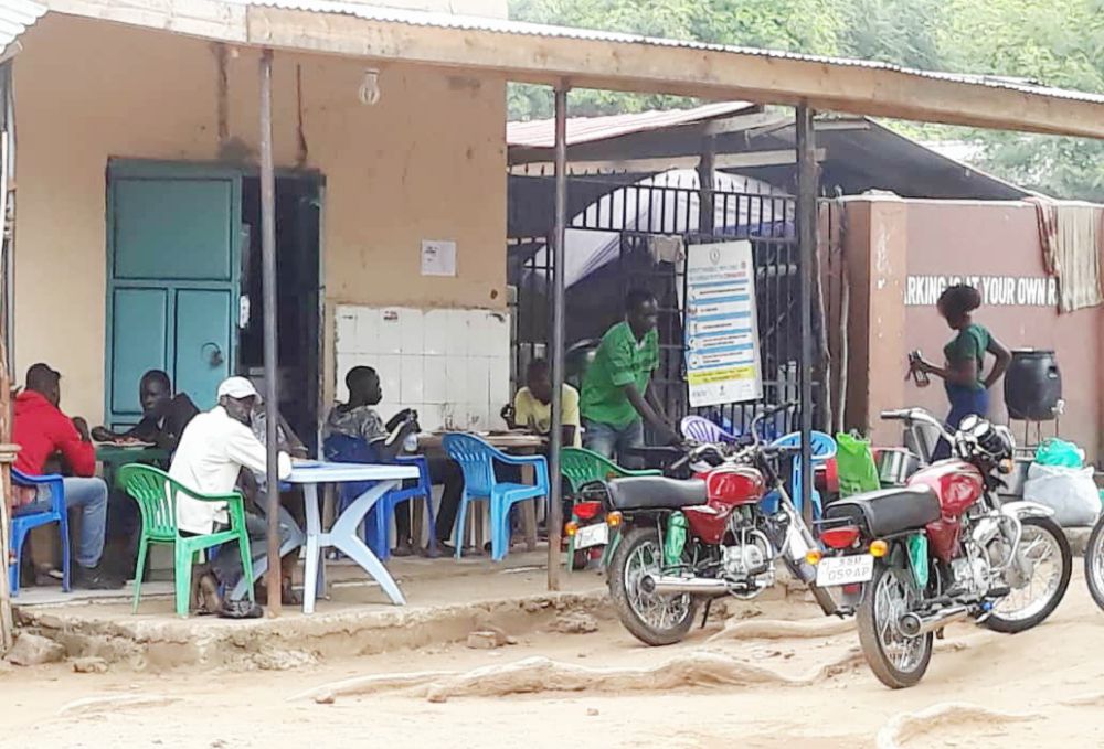 Some women earn a living by managing this food kiosk, which provides tea, maize and beans to passing businessmen on motorcycles in Juba, South Sudan. (Provided photo)