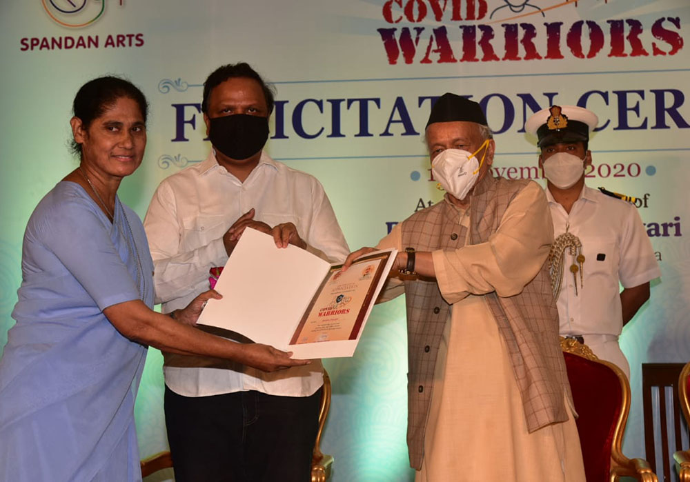 Holy Spirit Sr. Sneha Joseph receives the COVID-19 Warrior award on Nov. 1 from Bhagat Singh Koshyari, governor of the western Indian state of Maharashtra. (Provided photo)