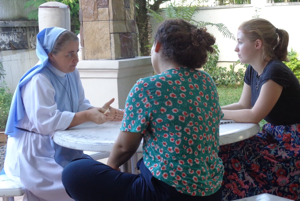 Sr. Sophie de Jésus, left, meets visitors in the garden of the School of Life, a residential program for girls ages 15 to 21 in Quezon City, part of metropolitan Manila, in December 2019. (Charity Durano)