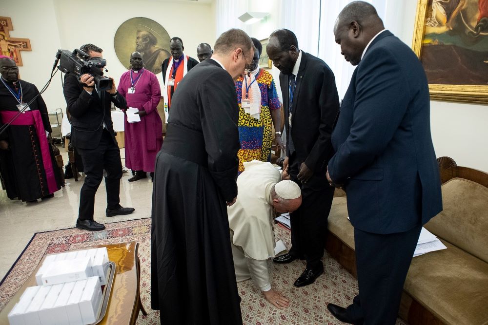 Pope Francis kneels at the feet of South Sudan President Salva Kiir at the conclusion of a two-day retreat at the Vatican for the African nation's political leaders, in this April 11, 2019, file photo. (CNS/Reuters/Vatican Media)