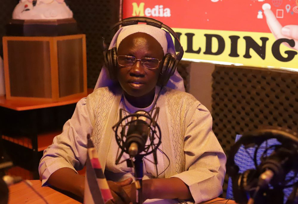 Sr. Mary Lilly Driciru of the Missionary Sisters of Mary Mother of the Church hosts her weekly radio show at Radio Maria Uganda on April 30. (GSR photo/Doreen Ajiambo)