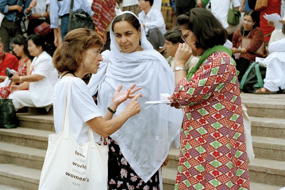 Women discuss the issues at the Non-Governmental Organizations Forum held in Huairou, China, Sept. 3, 1995, as part of the United Nations Fourth World Conference on Women held in Beijing. (U.N. Photo/Milton Grant)