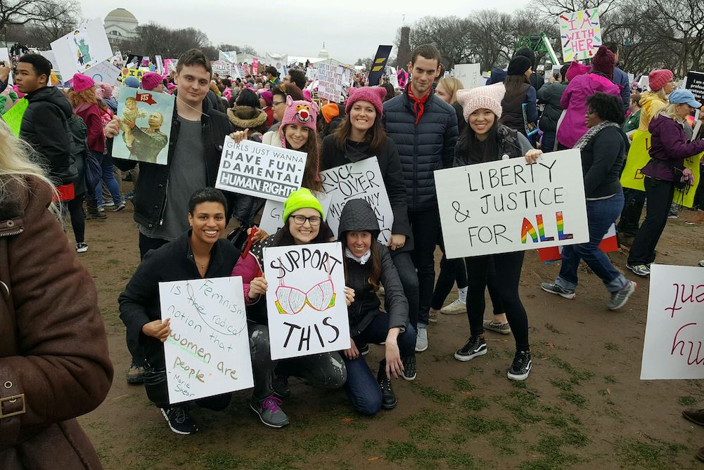 The Women's March, held in a number of cities around the U.S. in January 2017, kicked off a new wave of protests that have spanned President Donald Trump's first term. Katie Killpack, is pictured third from right, standing at the march in Washington, D.C.