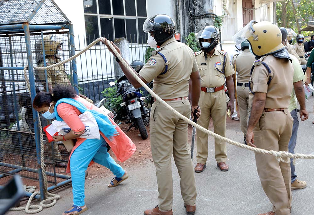 Security persons let people inside the Additional District and Sessions Court in Kottayam, Kerala, India, where Jalandhar Bishop Franco Mulakkal was acquitted on Jan. 14 of the charge of raping a nun. (M.A. Salim)