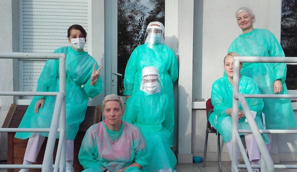 Two Sisters of Mercy of the Holy Cross, center, who recovered from COVID-19 and acquired some immunity, went to help with the care for the elderly in assisted living facilities in Zagreb, Croatia. (Croatian Conference of Religious)