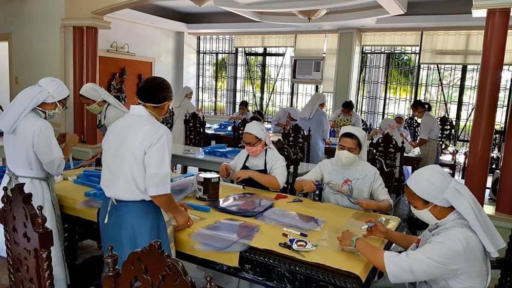 The Sisters of St. Paul de Chartes in the Philippines support frontline workers by producing face shields. (Association of Major Religious Superiors of the Philippines) Sisters of St. Paul de Chartes making face shields.