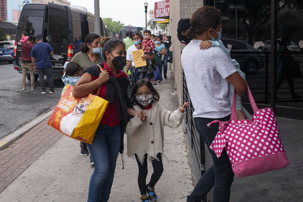 Immigrants who were staying at a shelter in Reynosa, Mexico, arrive March 23 at the Humanitarian Respite Center in McAllen, Texas. (Nuri Vallbona)
