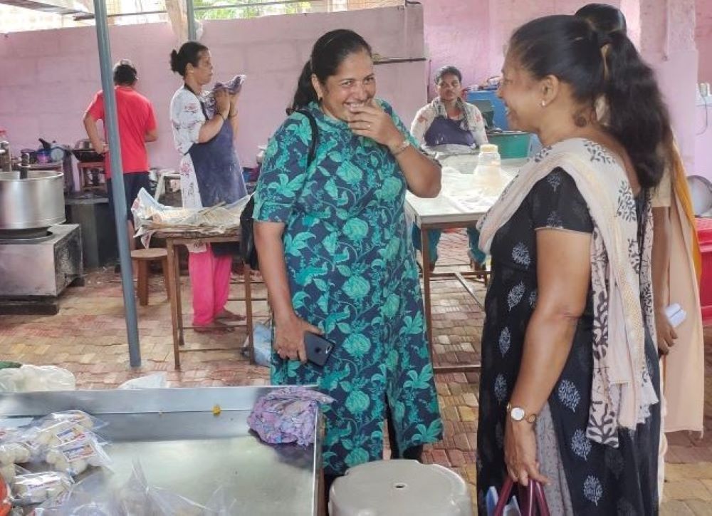 Entrepreneur Lavina D'Cunha, second from right, shares a lighter moment with Clara D'Cunha (no relation), right, at Lavina D'Cunha's food factory. Clara D'Cunha is the coordinator of the entrepreneurship project in Mangaluru, southern India. (Thomas Scari