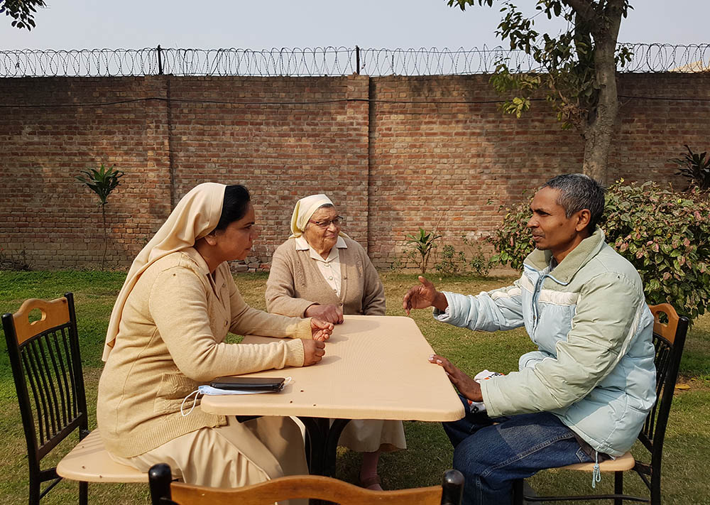 Sisters of Charity of St. Jeanne-Antide Thouret counsel Kamran, one of the 35 mentally disabled males at Dar ul-Karishma. (Kamran Chaudhry)