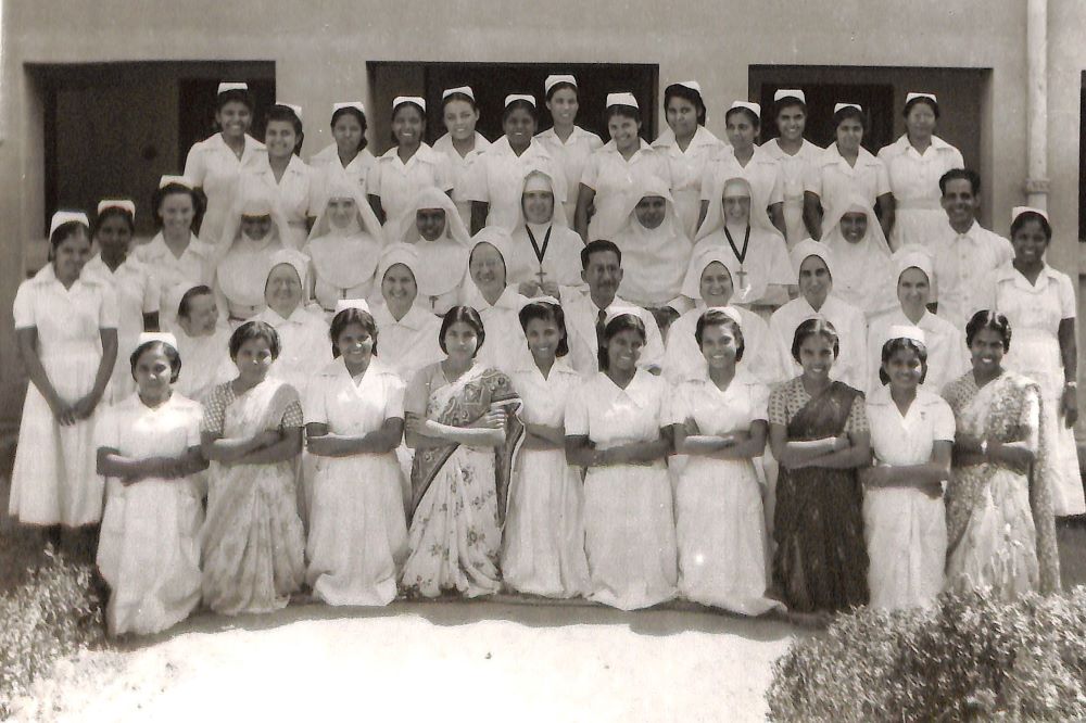 Members of the faculty and student body of the newly opened school of nursing at Nazareth Hospital in Mokama, India, in October 1953. The students are a mix of Indian women and nuns from other orders, pictured in full white veils and wimples.