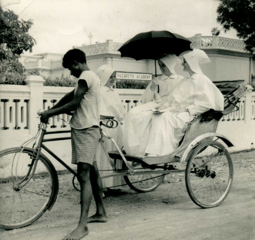 A cycle rickshaw driver with Sisters of Charity of Nazareth at Nazareth Academy in Gaya, India. (Courtesy of Viking Press/Sisters of Charity of Nazareth Archival Center)