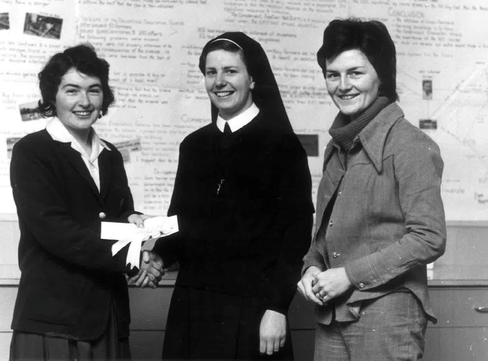 Loreto Sr. Patricia Murray, center, and colleague Phyllis McMonagle, right, congratulate Loreto College Cavan student Helen O'Callaghan for her success in the Irish national Young Scientist Exhibition in this undated photo early in Murray's religious life