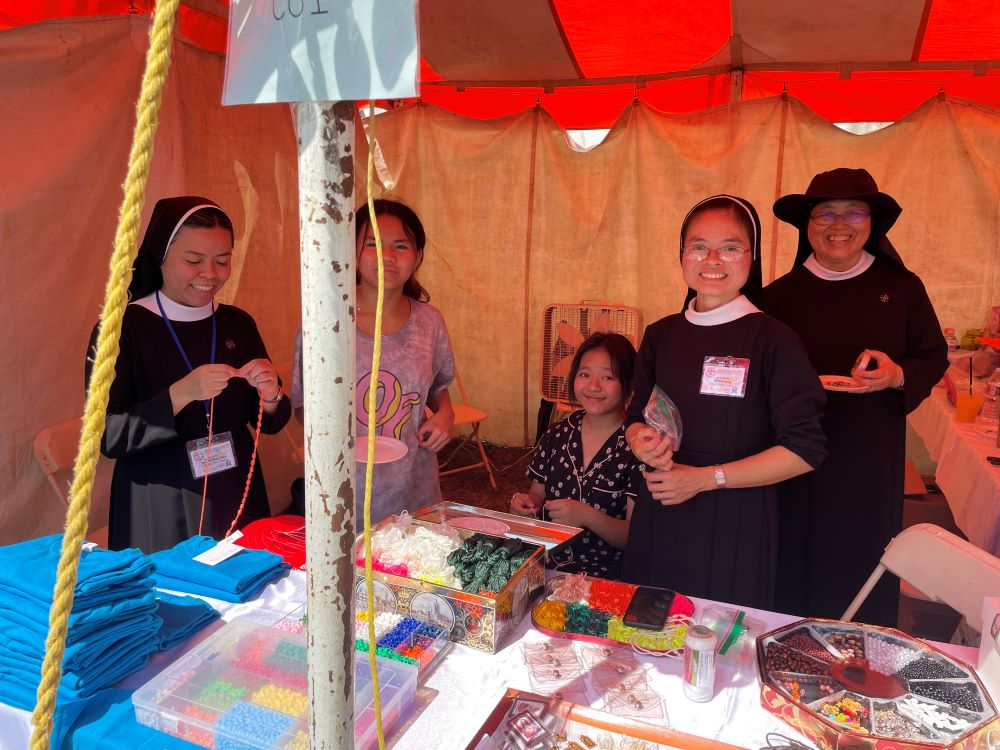 Several women religious congregations were represented at the event. Here is the religious gift shop of Lovers of the Holy Cross. (Peter Tran)